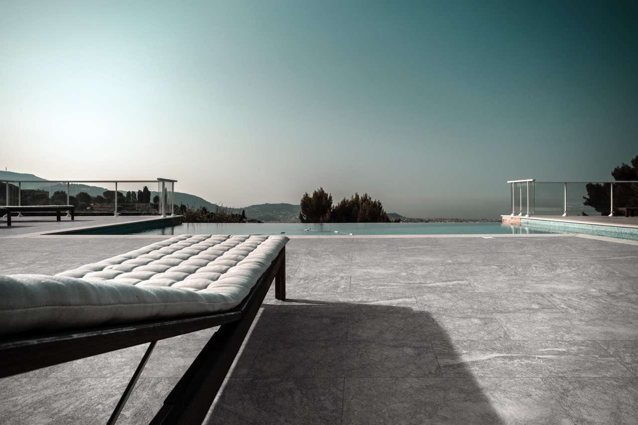 Private swimming pool. Modern villa in Nice, France. Pineta Black marble pool pavers